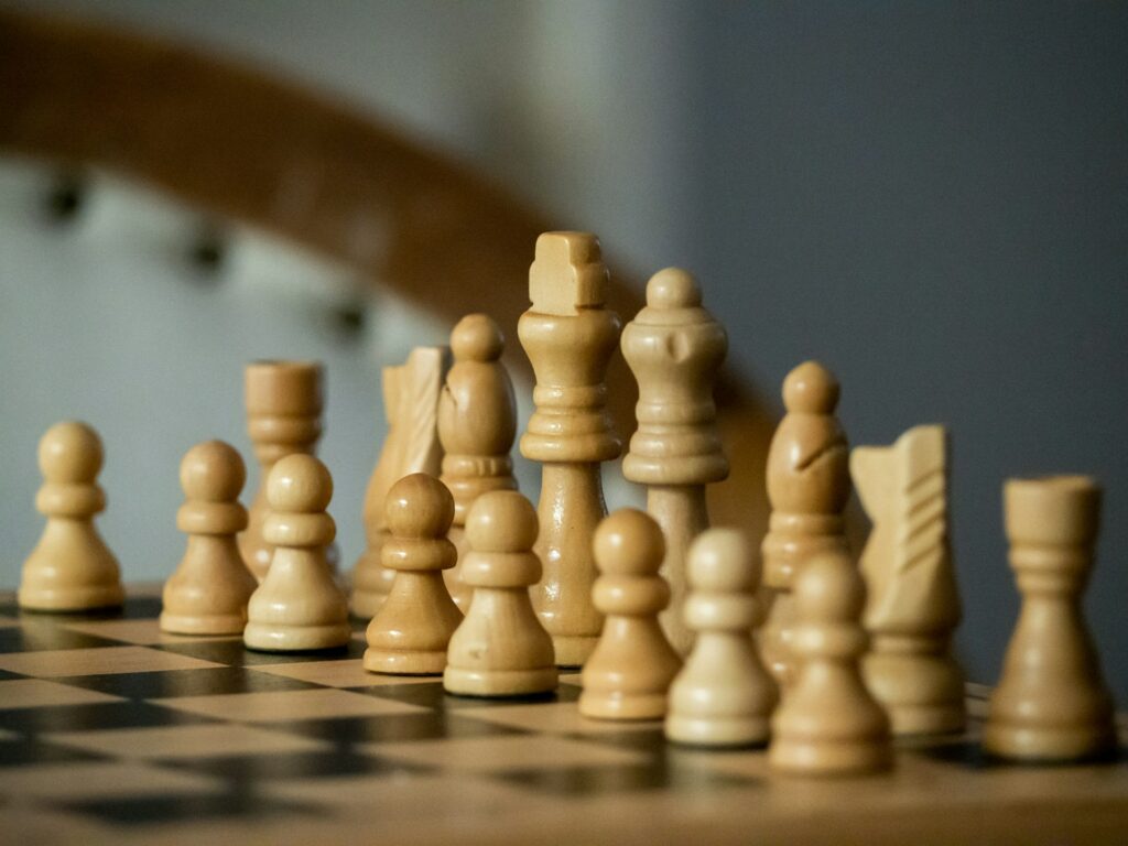 All the white chess pieces on a board