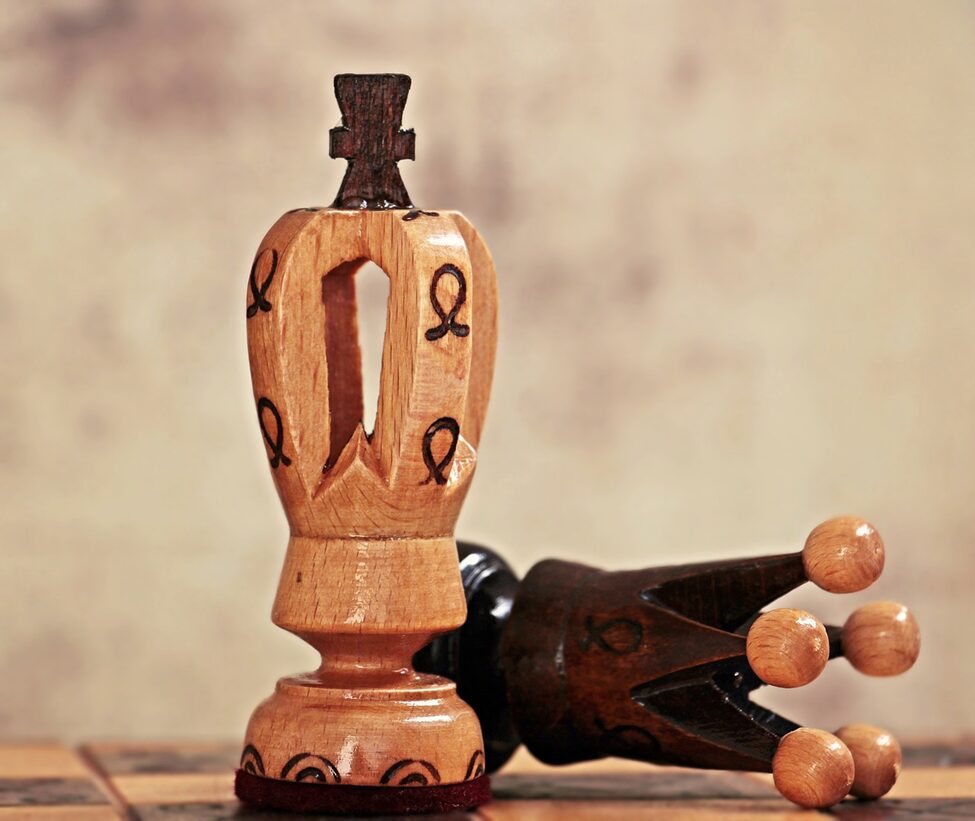 two chess pieces with unique designs