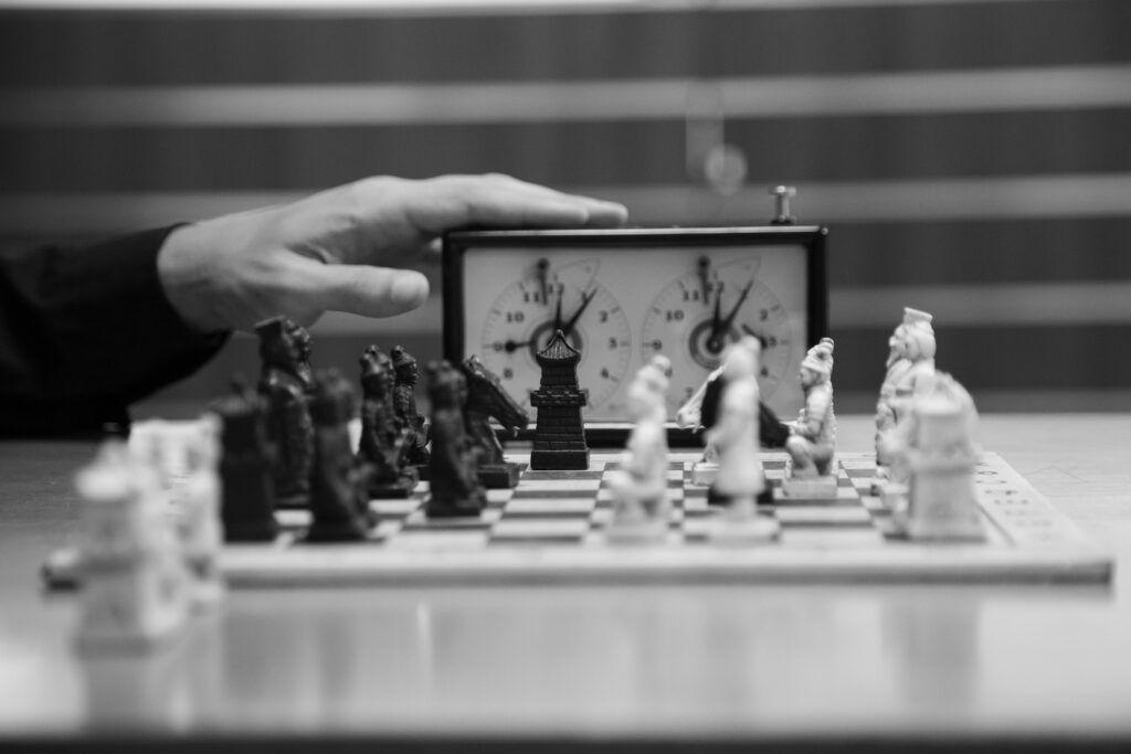 Player using chess timer during a match