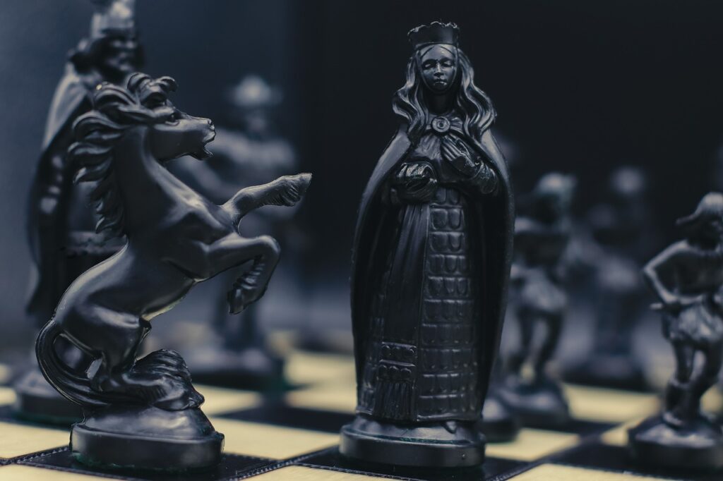 Close-up of uniquely designed chess pieces on a chessboard, showcasing a different interpretation of the game.
